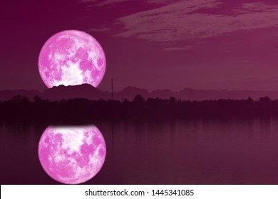 strawberry moon on night sky back silhouette mountain reflection on river, Elements of this image furnished by NASA