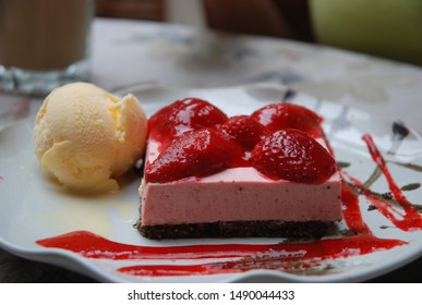 Strawberry Mousse On Oreo Crust, Served With Vanilla Ice Cream.