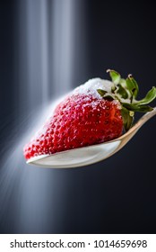 Strawberry On A Spoon With Raining Suger