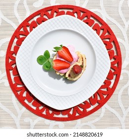 Strawberry Pie On A White Plate On A Red Round Placemat, Top View