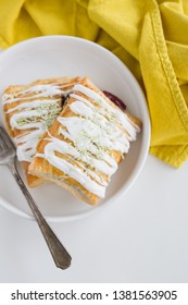 Strawberry Poptart With Icing And Green Sprinkles On White Background