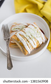 Strawberry Poptart With Icing And Green Sprinkles On White Background