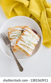 Strawberry Poptart With Icing And Green Sprinkles On White Background