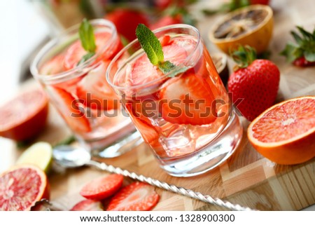 Strawberry punch home made cocktail closeup on wood background