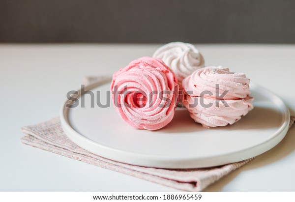 Strawberry and\
raspberry zephyrs on a nordic\
plate