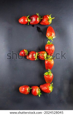 Strawberry in the shape of the number three. Concept 3 font set