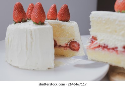 Strawberry short cake on white table at tea party. Dessert background wallpaper, Korea and minimal style. 