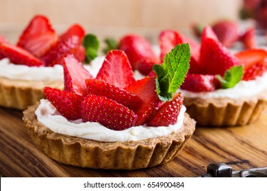 Strawberry Shortcake Pies On Rustic Wooden Table,  Perfect Party Individual Fresh Fruit Dessert 