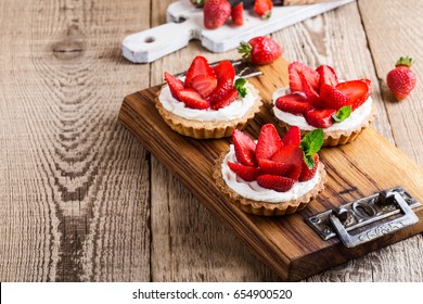 Strawberry Shortcake Pies On Rustic Wooden Table,  Perfect Party Individual Fresh Fruit Dessert 