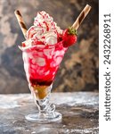 Strawberry Shortcake Sundae shipped cream shake with straw served in glass isolated on dark background side view of healthy drink