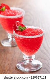 Strawberry Slushie Cups Decorated With Mint On Wooden Table