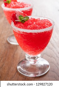 Strawberry Slushie Cups Decorated With Mint On Wooden Table