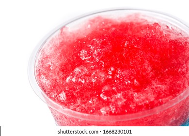 Strawberry slushie in plastic cup isolated on white background. Close up