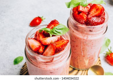 Strawberry smoothie with banana and basil in jar on light gray background, healthy food for breakfast and snack. Selective focus. Place for text - Powered by Shutterstock