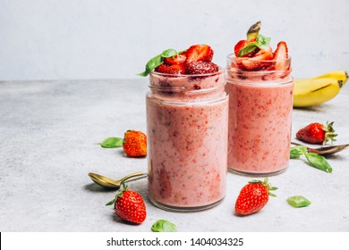 Strawberry smoothie with banana and basil in jar on light gray background, healthy food for breakfast and snack. Selective focus. Place for text - Powered by Shutterstock