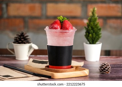 Strawberry Soda With Black Paper Sleeve Pet Cup For Your Text In Coffee Shop Interior Decoration Vintage, On Wooden Board, Takeaway Drink.