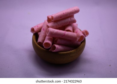 Strawberry sweet Wafer Cream Rolls isolated on violet background - Shutterstock ID 2174322963