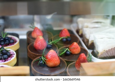 Strawberry Tart In The Refrigerator For Sale In The Busy Day,Cake Ready To Sale For Eat With The Coffee In Thailand 's Cafe,coffee Shop. 