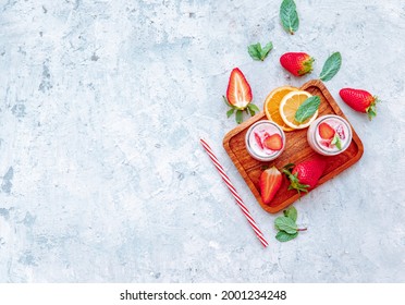 Strawberry Yogurt With Fresh Berries, Healthy Food And Drink Concept. Top View, Flat LayStrawberry Yogurt With Fresh Berries, Healthy Food And Drink Concept. Top View, Flat Lay