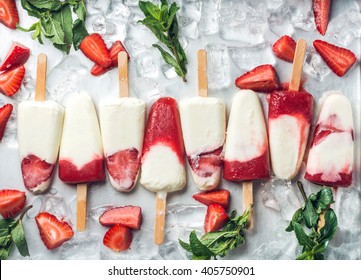 Strawberry Yogurt Ice Cream Popsicles With Mint Over Steel Tray Background. Top View