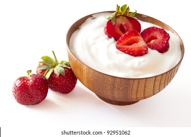 Strawberry And Yogurt  In A Wooden Bowl On Withe Background