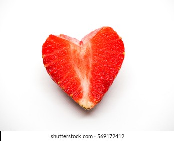 Strawberry's cut a heart shape on white background.