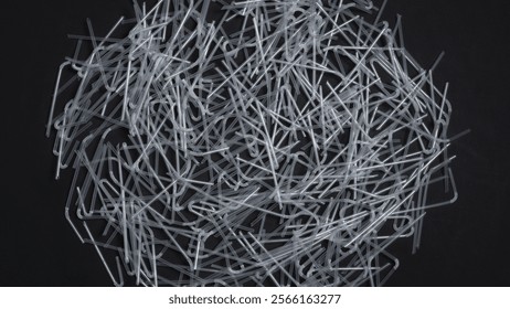 Straws made of plastic for drinking. Disposable plastic spinning on the table. Background, for Say no to plastic campaign and awareness. Pollution of the environment and ecology. Plastic straws ban. - Powered by Shutterstock