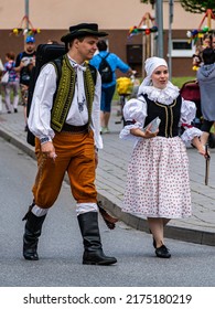Straznice, Czech Republic - June 25, 2022 International Folklore Festival A woman and a man in folk costumes talk to each other