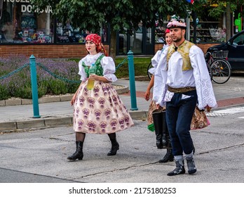 Straznice, Czech Republic - June 25, 2022 International Folklore Festival. Two girls and a boy in folk costumes at the festival