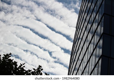 Streak clouds over a glass facade in the city of frankfurt
