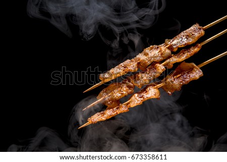 streaky pork mala grilled on table with blackground (selective focusing)