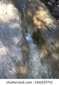 Stream between rocks - alpine pass