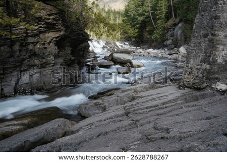 Stream flowing from Sacred Dancing Cascade waterfall on Going to the Sun Road