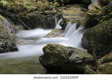 stream in the forest,waterfall and ray in forest
