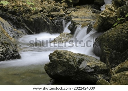 stream in the forest,waterfall and ray in forest
