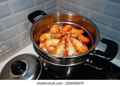 Stream Fresh Cooked Shrimp. Seafood On The Kitchenware ,Close-up Shooting Of Seafood In Home Kitchen.Peeled Shrimp.