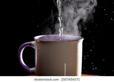 A stream of hot steaming water being poured into a tea cup - Powered by Shutterstock