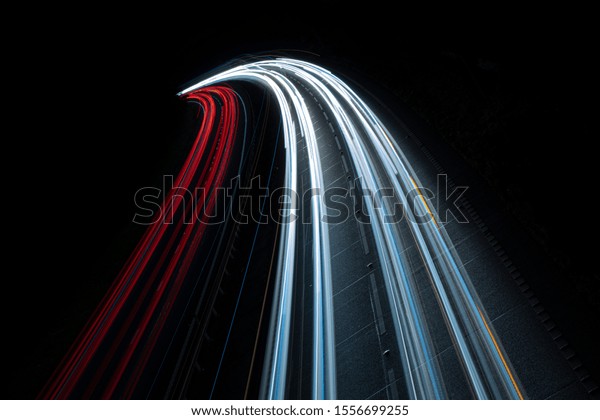 Stream of light
trails on motorway at
night