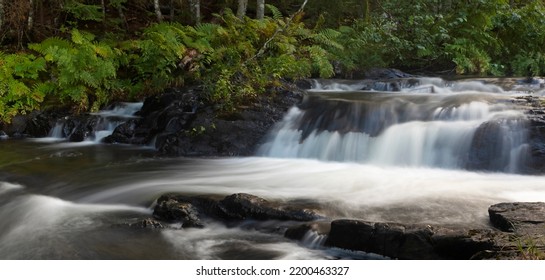 Stream In Maine Running Over Boulders In A Forest