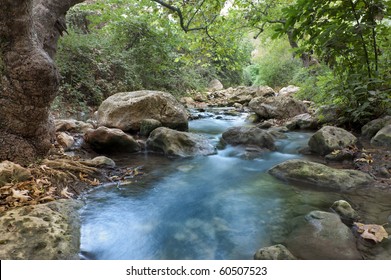 Stream with rocks in motin blur at Kziv river in the Galilee northen Israel