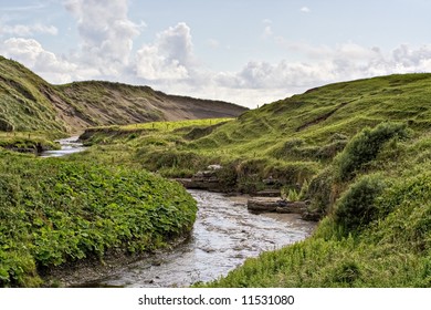 A Stream In Rolling Hills Of Ireland