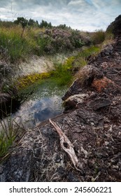 Stream Running Through Peat Bog Landscape In Ireland