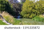 A stream surrounded with trees flows through Caldwell, Idaho.