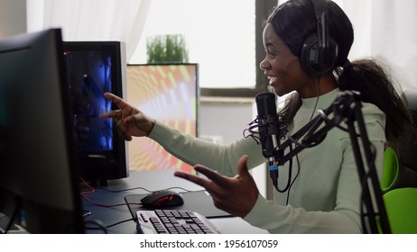 Streamer Woman Winning Space Shooter Video Game During Esport Tournament. Pro Gamer Using Wireless Controller, Professional RGB Mouse And Headset Late At Night In Streaming Home