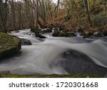 Streams and rapids of river in long exposure in spring in Galicia