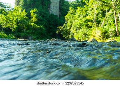 Streams of water between mountain stones in close-up. Beautiful alpine river stream with fast running water and pebbles. Flowing water in a gorgeous scene. Beautiful river rapids. - Shutterstock ID 2239023145