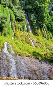 The streams of water coming down from the hill in the Natural park of Monasterio de Piedra in Nuevalos, Zaragoza, Spain - Shutterstock ID 568696858