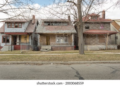 Street of abandoned houses in urban Detroit on cloudy day