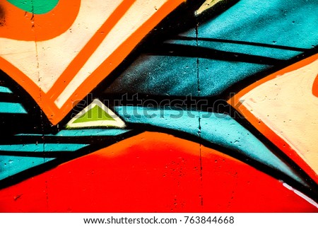 Street art - graffiti painting on the wall. Colorful shapes.  Abstract design.