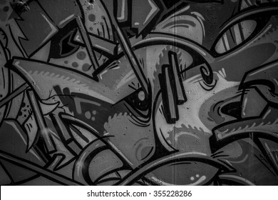 street art grafitti in black and white ink, segment of a dirty wall in the city